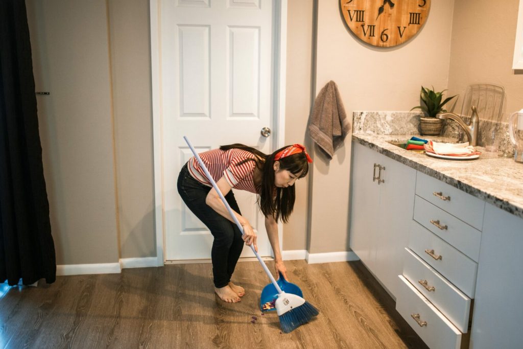 Maid Services Seattle WA woman sweeping floor